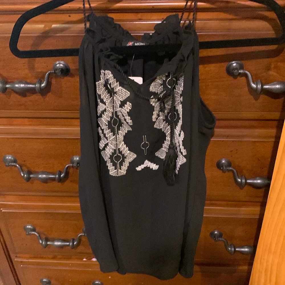 Black sheer tank top with white pattern on the front